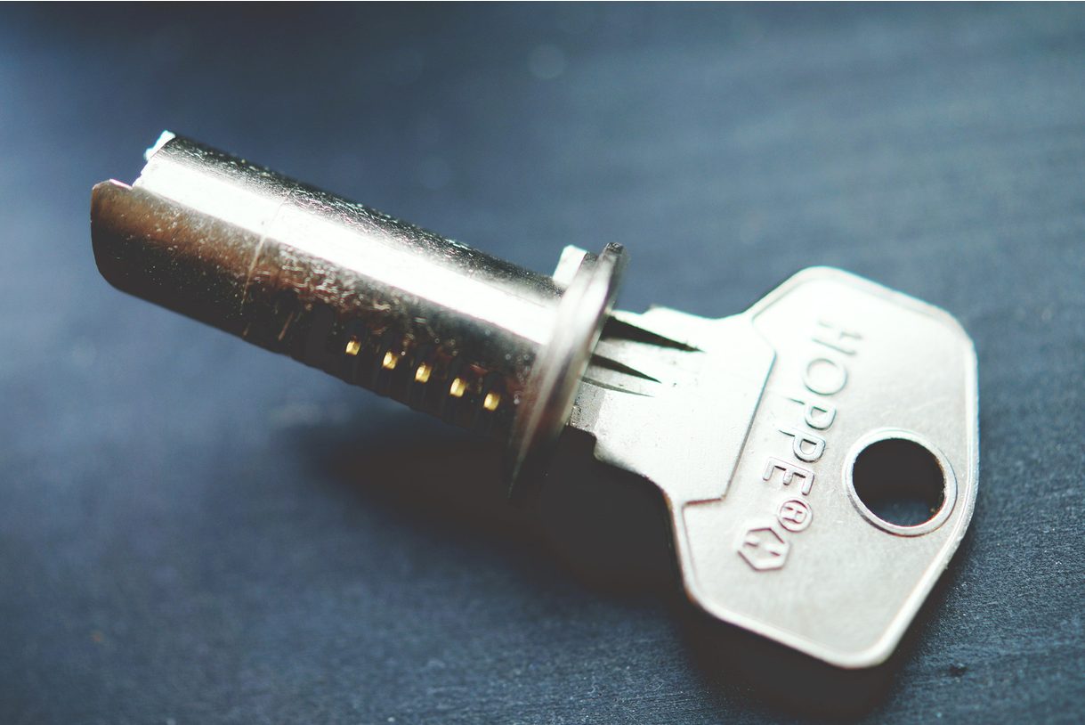 Lock cylinder plug with pins visible, as removed for rekeying