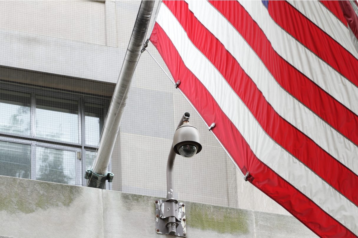 Outdoor PTZ security camera mounted on a building ledge