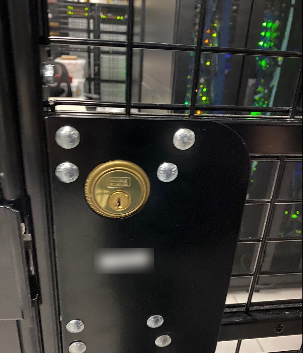 Keyed backup cylinder on a data center cage door built by RBD Security