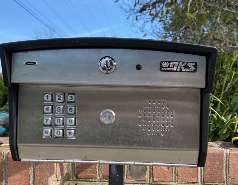 DoorKing DKS telephone entry panel on a brick gate pier, installed by RBD Security