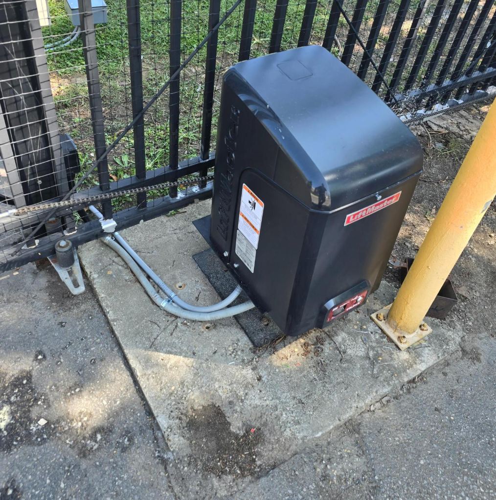 LiftMaster slide gate operator on a concrete pad, installed by RBD Security